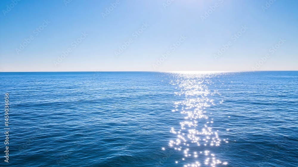 Poster sunlit path across a calm, deep blue ocean under a clear, vibrant sky; a tranquil seascape perfect f