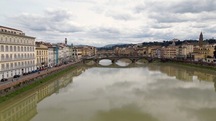 Obraz premium Europe, Italy, Florence , drone aerial view of Florence and Arno river - the Old Bridge , Ponte Vecchio , in city downtown of the Middle Ages and Renaissance art - Tourist attraction destination 