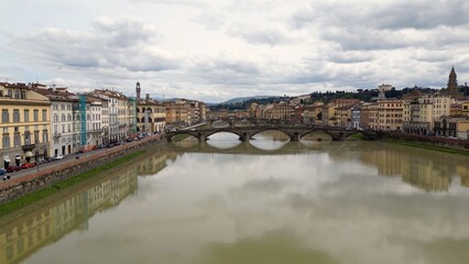 Obraz premium Europe, Italy, Florence , drone aerial view of Florence and Arno river - the Old Bridge , Ponte Vecchio , in city downtown of the Middle Ages and Renaissance art - Tourist attraction destination 