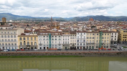 Obraz premium Europe, Italy, Florence , drone aerial view of Florence and Arno river - the Old Bridge , Ponte Vecchio , in city downtown of the Middle Ages and Renaissance art - Tourist attraction destination 
