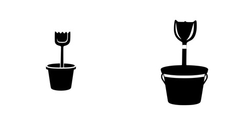 Gardening tools featured as flat black icons representing a trowel and a shovel set in a simple and recognizable design
