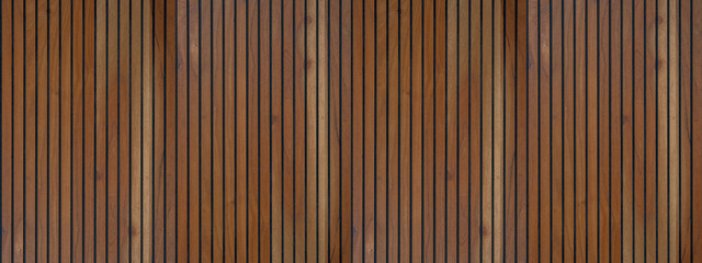 Wood background banner panorama long - Brown wooden acoustic panels wall texture , seamless pattern, vertical