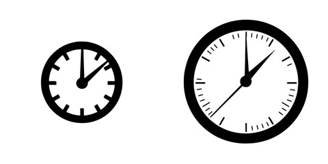 Flat black icons of two clocks showing different times