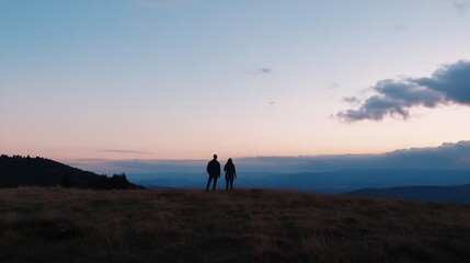 Fototapeta premium Silhouette of a couple admiring a breathtaking sunset over a vast mountain range, their backs turned towards the camera, enjoying the serene landscape. : Generative AI