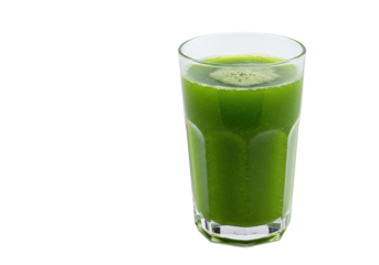 Vibrant green juice fills a faceted glass set against a dark backdrop evoking health and refreshment