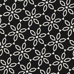 Abstract monochrome seamless pattern in oriental style. Vector floral geometric ornament. Black and white texture with stars, flowers, diamonds, diagonal lattice. Elegant background. Repeating design