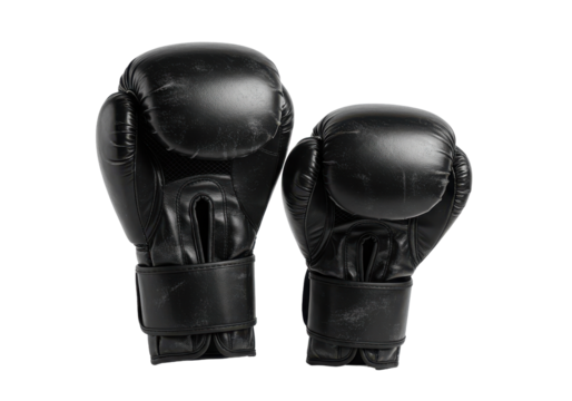 Black boxing gloves stand ready against the void poised for a silent match