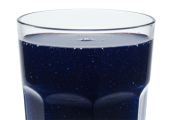 Cobalt elixir in a glass Bubbles dance in deep blue liquid against a stark black background