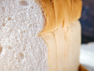 Close-up of freshly sliced ​​soft and fragrant bread with white bread,brown bread crust macro