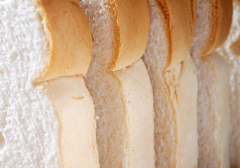 Close-up of freshly sliced ​​soft and fragrant bread with white bread,brown bread crust macro