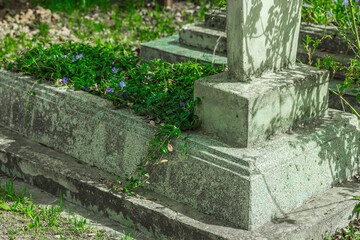 Memory Day concept. Ancient cemetery with stone graves in a quiet rural landscape