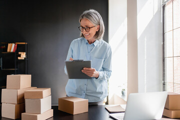 Woman, tablet and checklist for small business, ecommerce and boutique startup with online sales. Owner, delivery planning and digital website for internet store, retail service and quality control