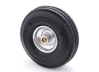Pneumatic rubber tire and wheel on white