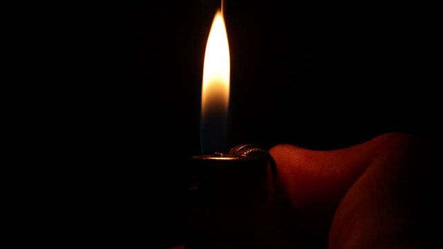 Flicking a Lighter in the Dark in slow motion - Horizontal