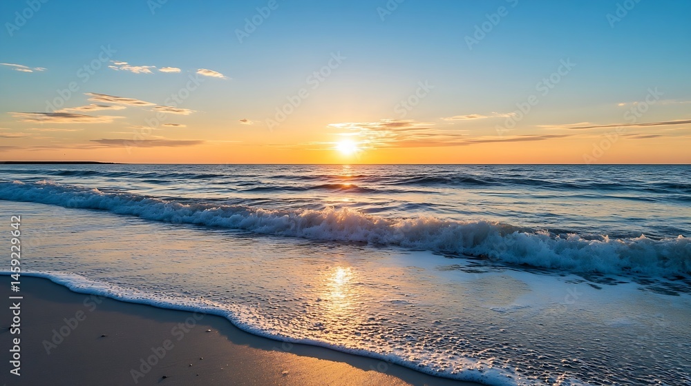 Poster serene sunset over ocean waves gently lapping a sandy beach, creating a tranquil and picturesque coa