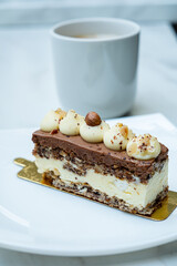 Enjoy a rich chocolate slice with a steaming cup of coffee—a perfect sweet treat!