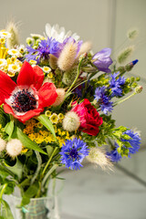 Colorful wildflowers are beautifully arranged in a glass vase, celebrating the joy of spring
