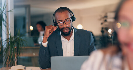 Man, headset and talking at call center, night and advisory services at legal agency with laptop. Person, virtual consultation and computer with voip, mic or contact us with help desk job at law firm