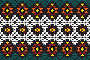A seamless ethnic geometric pattern with vibrant colors, tribal-inspired motifs and symmetrical elements, ideal for textile prints, boho fashion, or digital backgrounds with a modern folk-art feel.