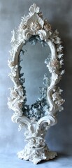 Ornate white mirror adorned with flora