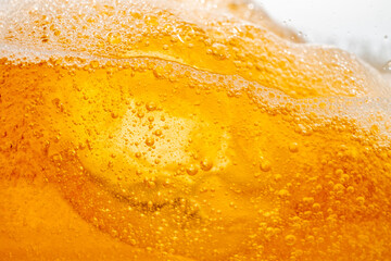 Close up bright orange Oil or beer splash texture and nature waves, Beautiful waves curve and little bubbles smooth for graphic design and background, Oil Bubbles, Soft beer bubbles, Selective focus