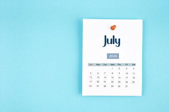 July 2026 calendar page with push pin on blue background. - Powered by Adobe