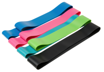 Colorful resistance bands cascade across black offering strength  vibrancy