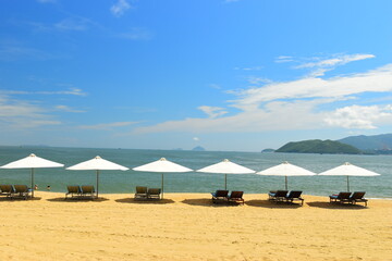 
Nha Trang Beach Vietnam. Overlooking the beautiful coast of Nha Trang with palm trees on the beach. Beautiful white sand tropical beach in the coastal city on the Shores of the South China Sea.