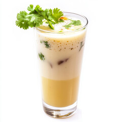 A glass of sol kadhi, with a refreshing drink made from coconut milk, kokum, and spices, garnished