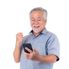 Happy senior Asian man using smartphone with joyful expression and fist pump gesture, celebrating success, wearing casual shirt, isolated on a transparent background, concept of technology achievement