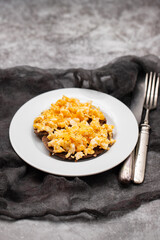 scramble eggs with black bread on dish