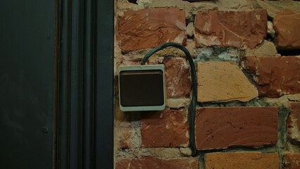 Old Wall Switch on Exposed Brick Background in Vintage Setting