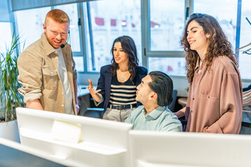 Customer service representatives working together on a solution for a client