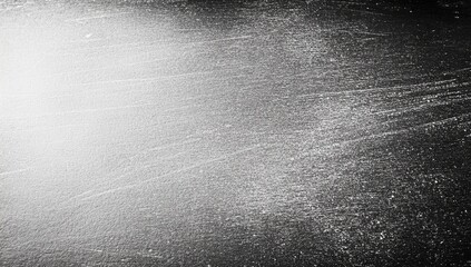 Gray surface with light streaks and texture.  Light source highlights a section