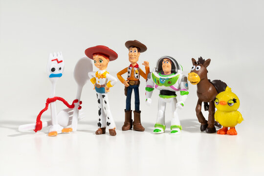 Toy Story figurines standing on white background