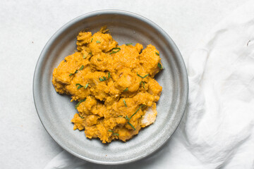 Overhead view of nigerian yam porridge, top view of nigerian asaro on a white backgroundOverhead view of nigerian yam porridge, top view of nigerian asaro on a white background