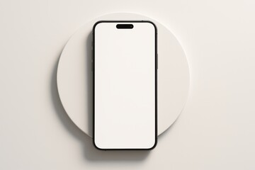 Smartphone Mockup on White Circle: A sleek black smartphone with a blank white screen rests on a minimalist white circular stand against a clean white backdrop.