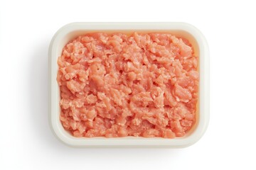 Raw Chicken in Package: Fresh, uncooked ground chicken fills a rectangular white container, presented in a photorealistic view of food preparation and culinary potential.
