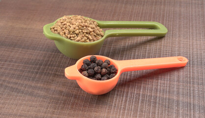 Methi or fenugreek seeds with methi leaves.Methi seeds is good for health.

