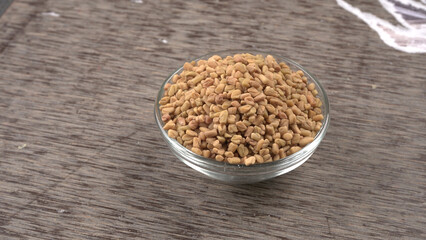 Methi or fenugreek seeds with methi leaves.Methi seeds is good for health.

