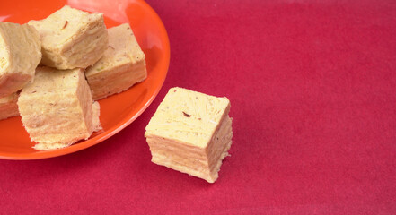 Patisa / Soan Papdi is a popular Indian cube shape flaky/crispy dessert. 
