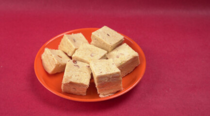 Patisa / Soan Papdi is a popular Indian cube shape flaky/crispy dessert. 
