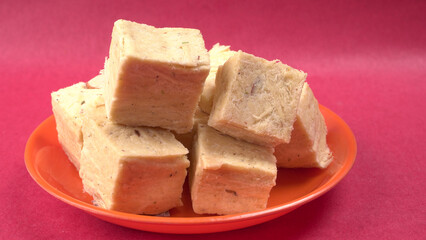 Patisa / Soan Papdi is a popular Indian cube shape flaky/crispy dessert. 
