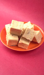 Patisa / Soan Papdi is a popular Indian cube shape flaky/crispy dessert. 
