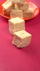 Patisa / Soan Papdi is a popular Indian cube shape flaky/crispy dessert. 

