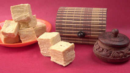 Patisa / Soan Papdi is a popular Indian cube shape flaky/crispy dessert. 
