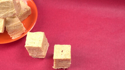 Patisa / Soan Papdi is a popular Indian cube shape flaky/crispy dessert. 

