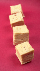 Patisa / Soan Papdi is a popular Indian cube shape flaky/crispy dessert. 
