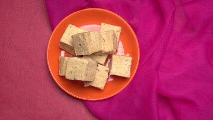 Patisa / Soan Papdi is a popular Indian cube shape flaky/crispy dessert. 
