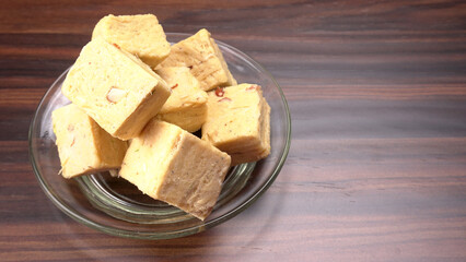 Patisa / Soan Papdi is a popular Indian cube shape flaky/crispy dessert. 
